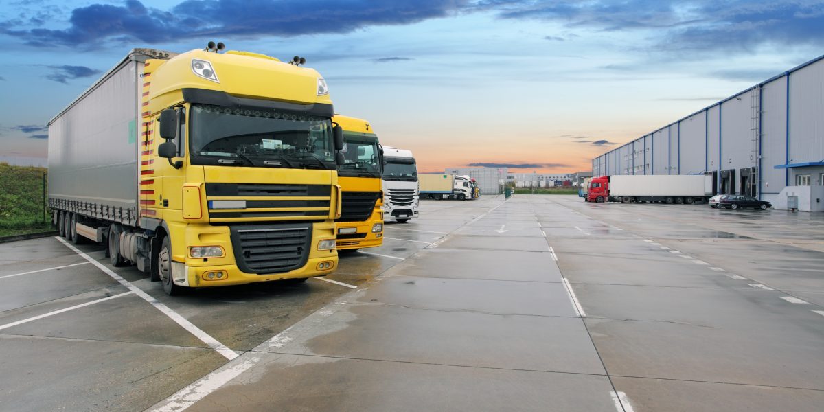 Cargo truck at warehouse building